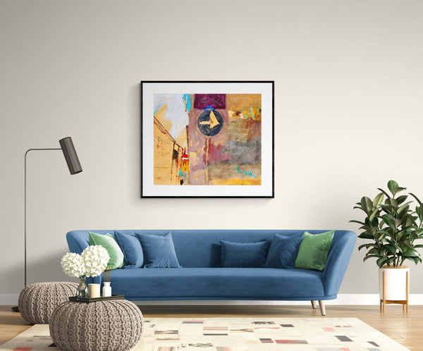 Case all'incrocio - Un quadro che rappresenta un cartello stradale con un palazzo sullo sfondo, sopra un divano.