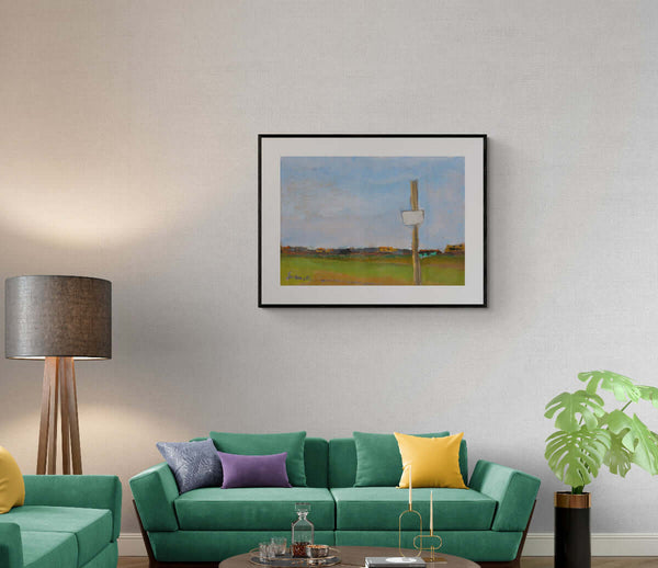 Il silenzio - Un quadro che mostra un segnale stradale immerso in un campo, esposto nel salotto.