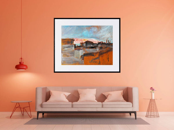 All'alba -  Immagine di una città all'alba, con edifici che si stagliano contro il cielo colorato