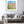 Vicino al cielo - Pittura di un paesaggio urbano con edifici che si ergono sullo sfondo.